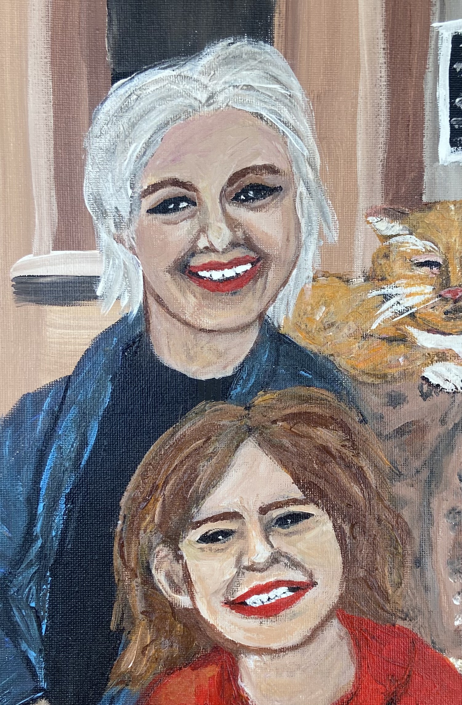 Lauren's painting of an older white woman with white hair in a blue cardigan sitting with a young girl with brown hair, a red shirt and a big smile.  An orange cat lounges behind them on the sofa.